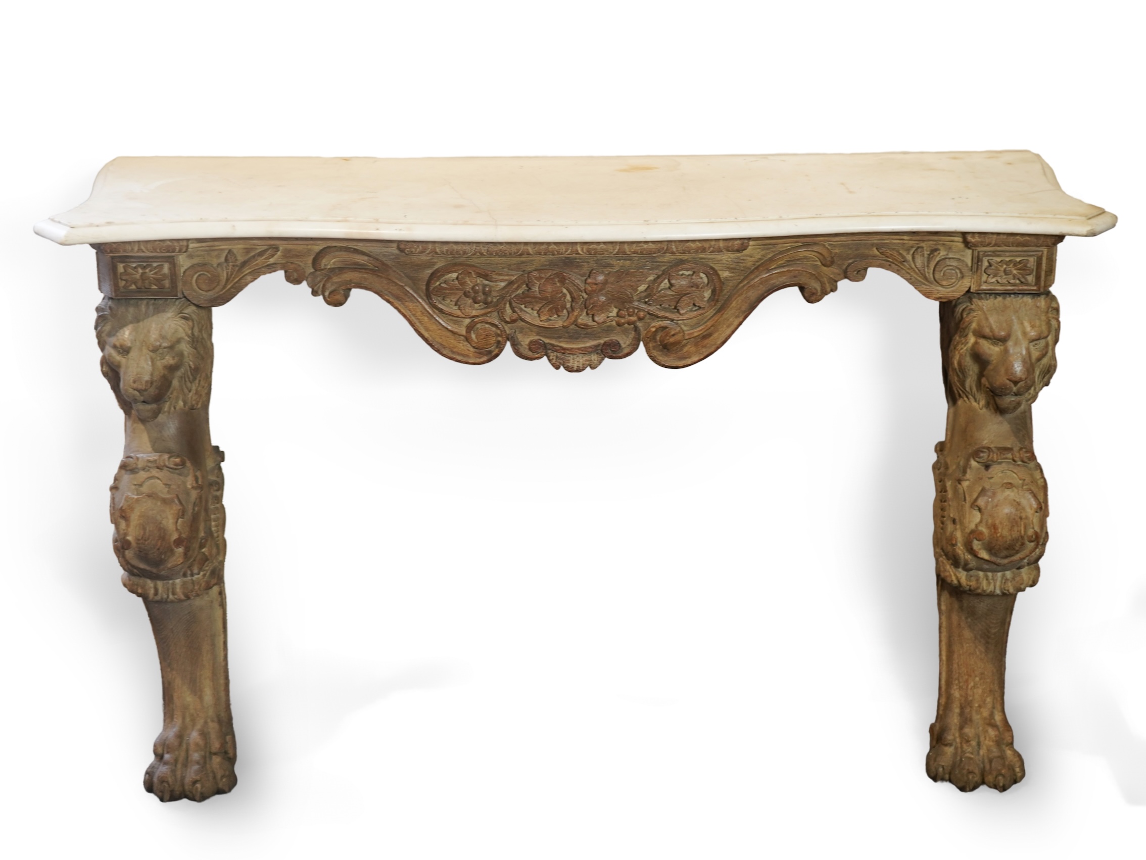 A 19th century Baroque style marble topped limed oak serpentine console table
